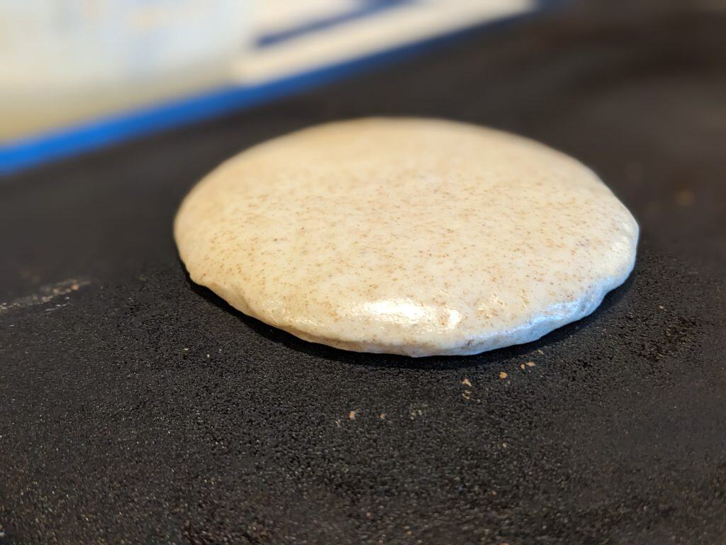 Pancake ready to be flipped. The edges are starting to look dry and well-formed.