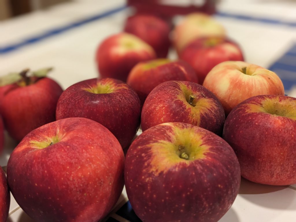 Beautiful red apples with golden rings around the stem