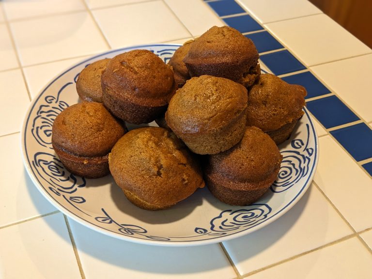a plate of delicious-looking pumpkin muffins